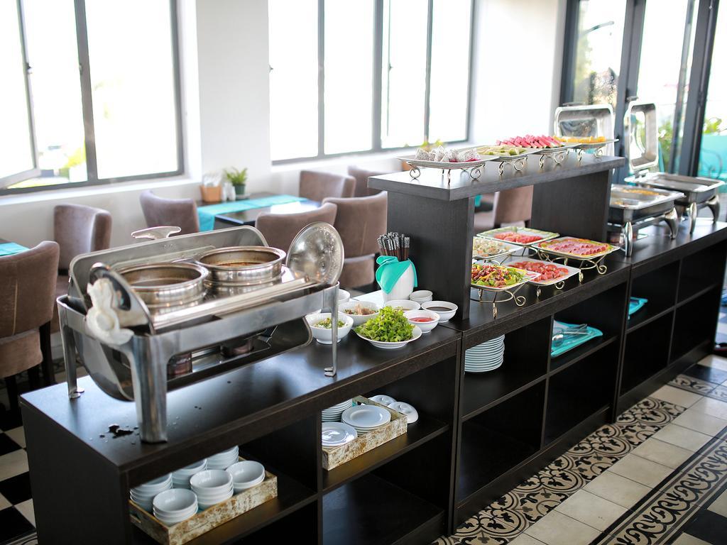 Flora Hotel & Residence Дананг Экстерьер фото
